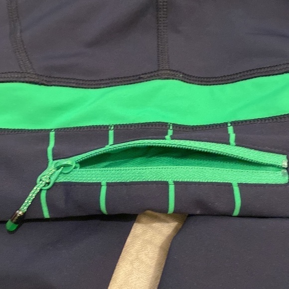 Lululemon navy leggings with back pocket. Size 2 - Picture 12 of 13